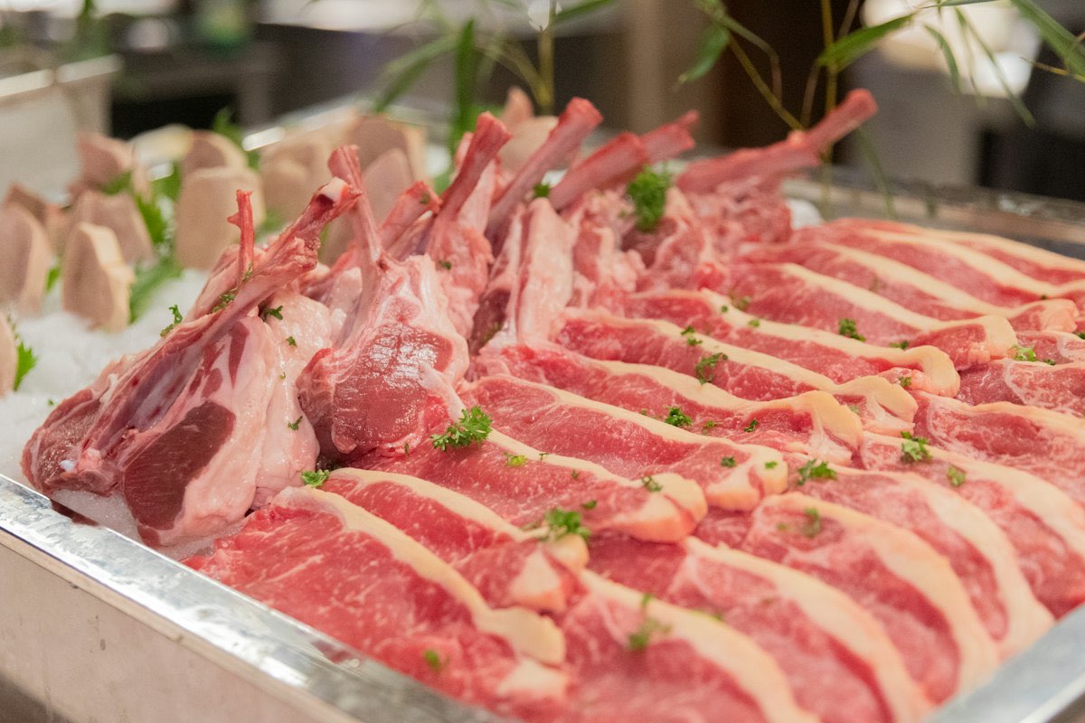 Raw lamb racks on a tray